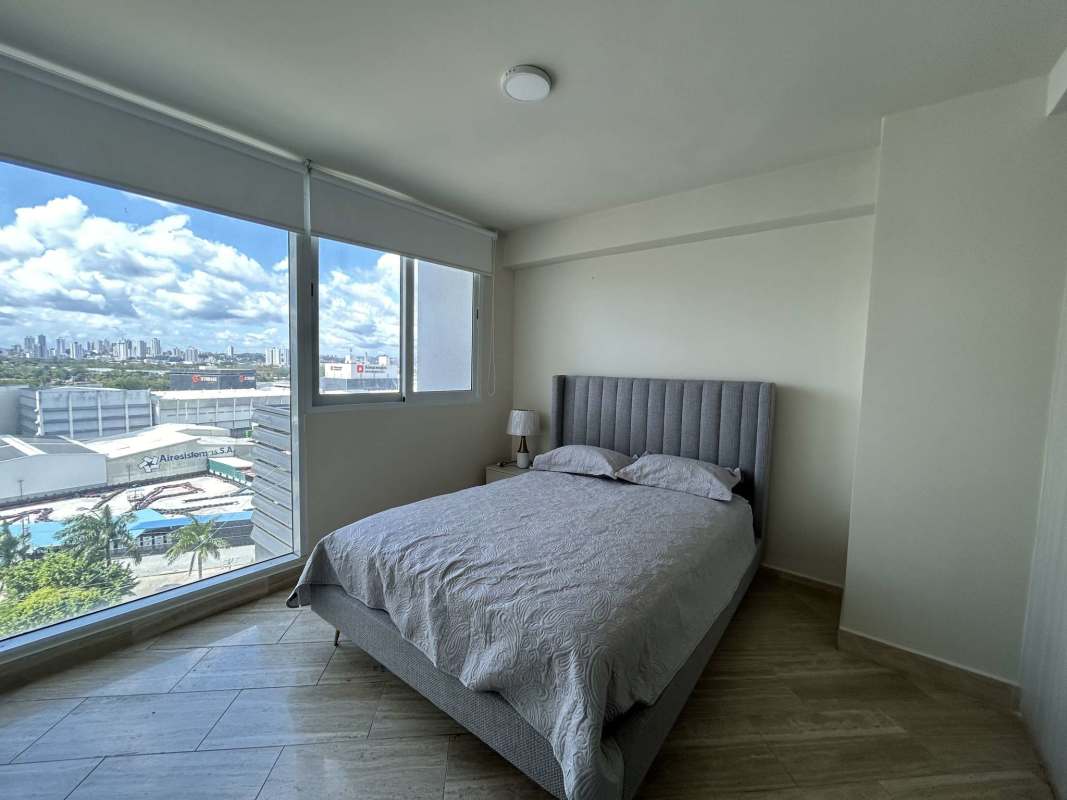 Bedroom with large window city view furnished at PH The Regent Costa del Este Panama