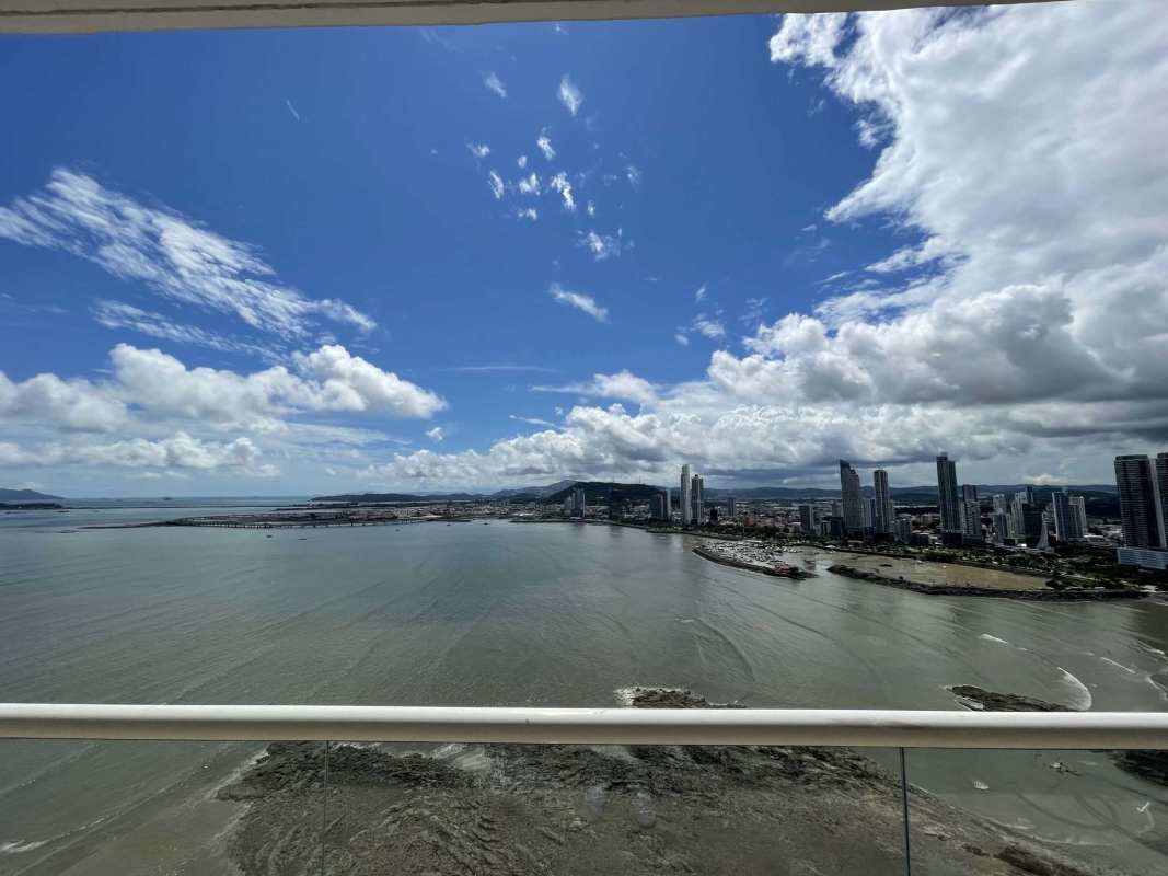 Spacious master suite with floor-to-ceiling windows and ocean view at PH Tower Punta Paitilla