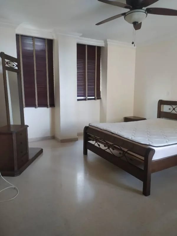Traditional bedroom with wooden furniture ceiling fan PH Del Rey El Cangrejo
