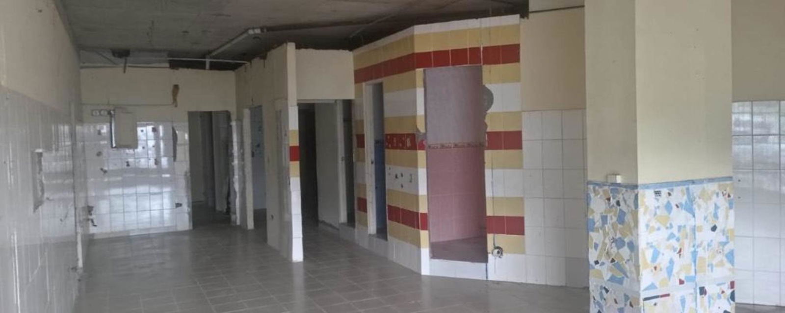 Unfinished interior with tiled partitions and exposed ceiling wiring commercial unit Rio Abajo Panama City