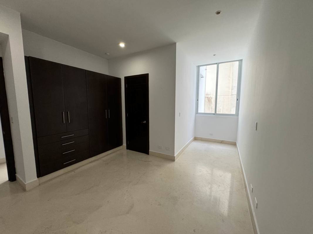 Spacious kitchen with granite countertops and dark cabinets PH Pacific Point Punta Paitilla