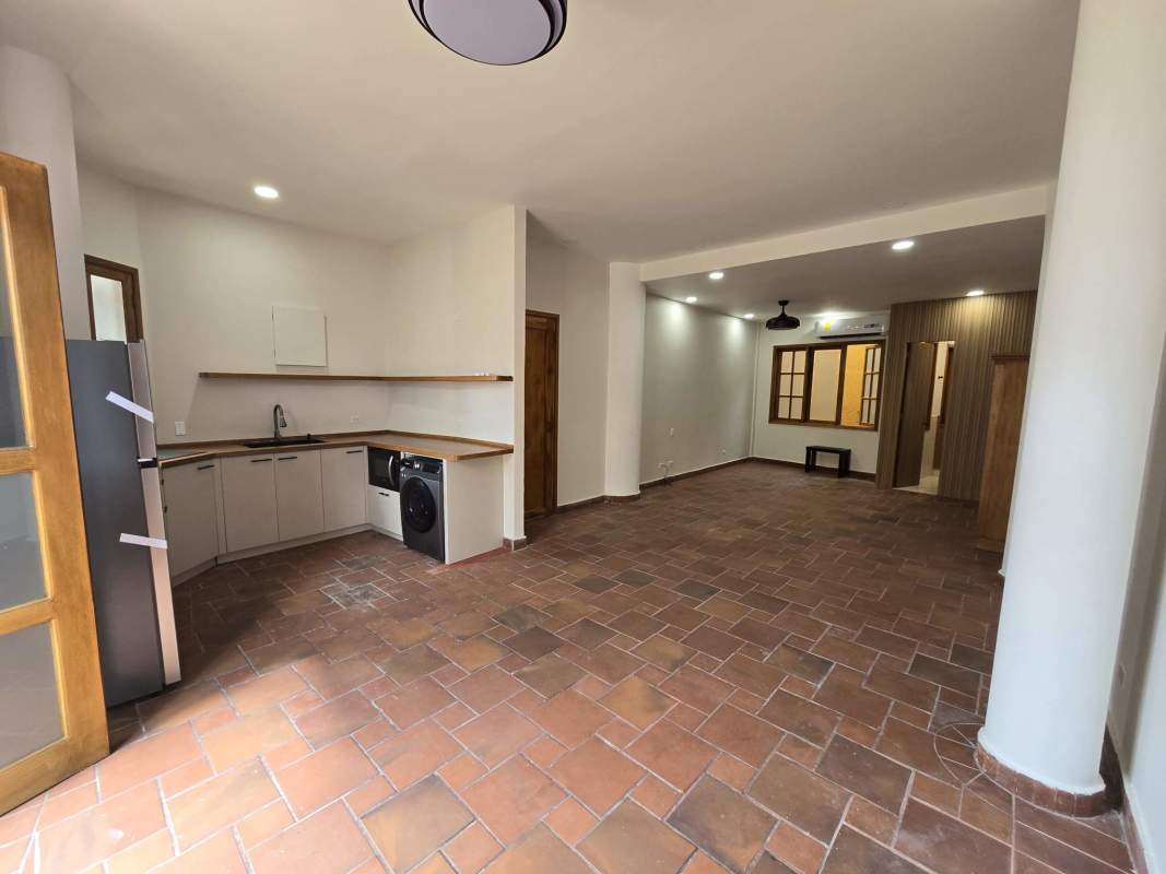 Bright Mediterranean-style kitchen and dining area with terracotta floors and wooden accents in Casco Viejo Panama
