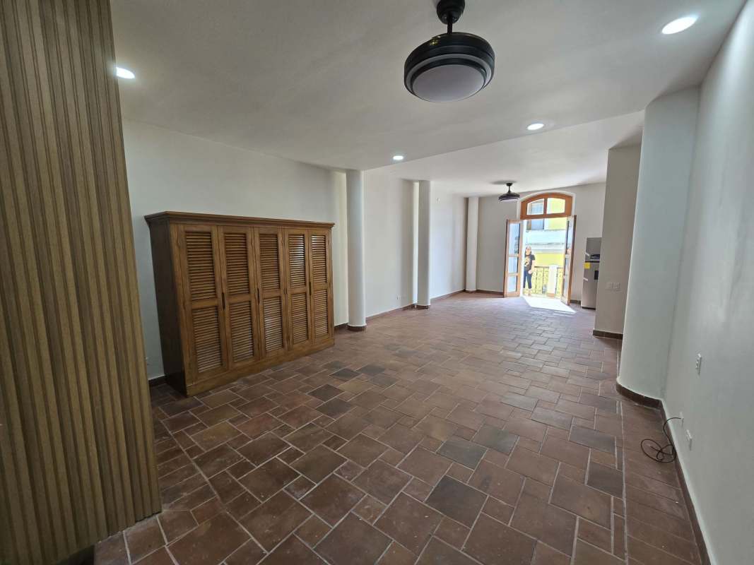 Open living dining space with natural wood detail and terracotta tiled floor in Casco Viejo Panama