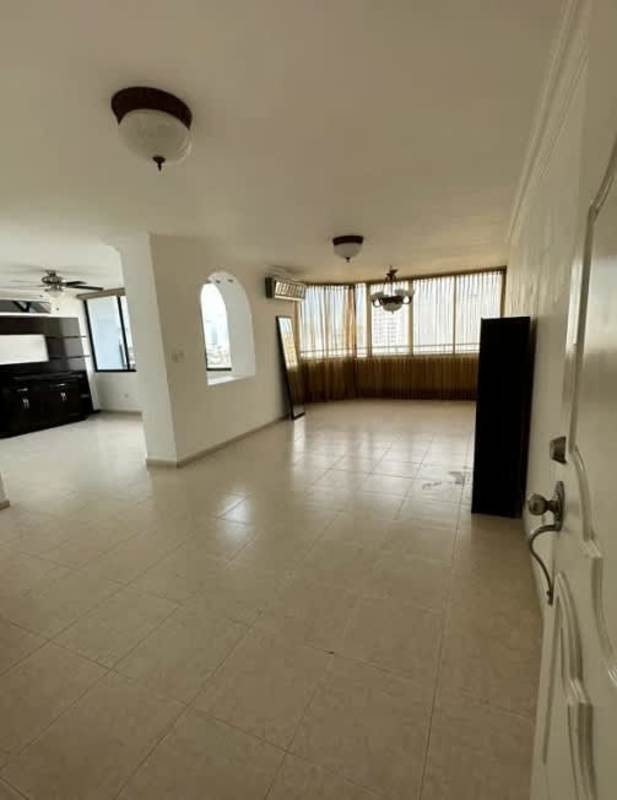 Modern kitchen with wood cabinets, black countertops, appliances PH Plaza Real San Francisco Panama