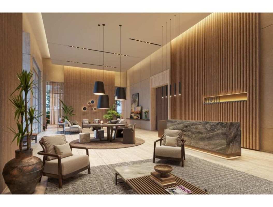 Spacious lobby area with seating, indoor plants, and pendant lighting at PH Corotú Santa María Panama