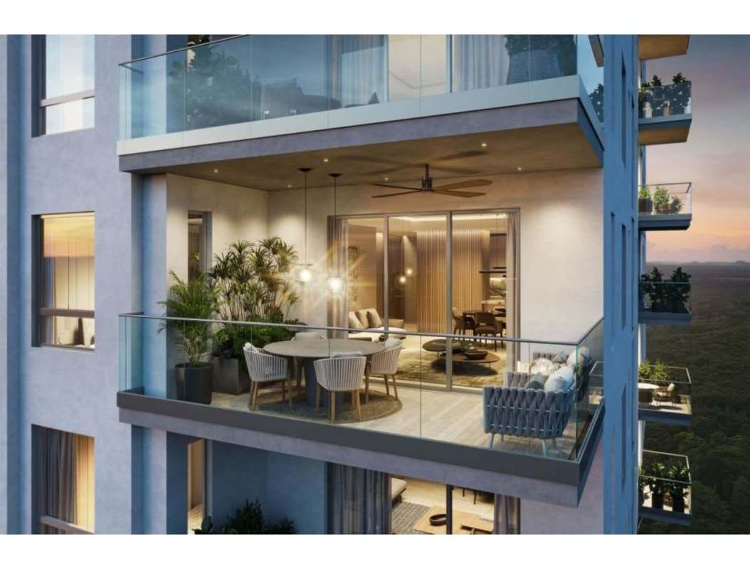 Large terrace balcony with lounge seats, dining, and glass railing at PH Corotú Panama