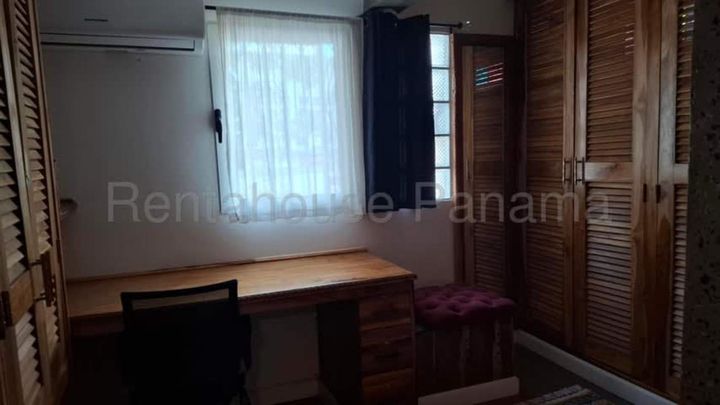 Spacious bedroom with closet, window, desk in PH Hato Pintado Gardens for rent in Panama City