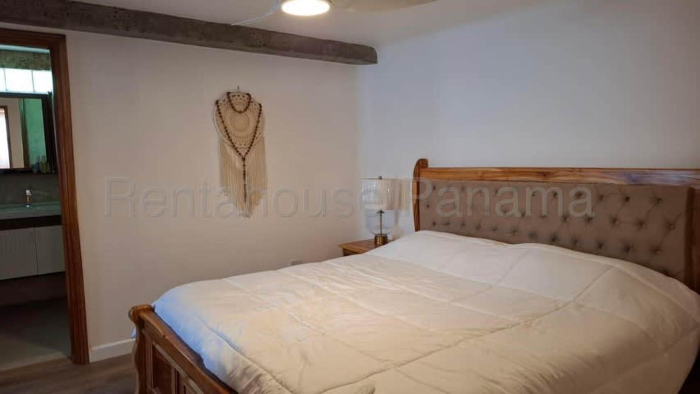 Stylish bathroom with mosaic tiles, glass shower enclosure, modern fixtures in Panama City