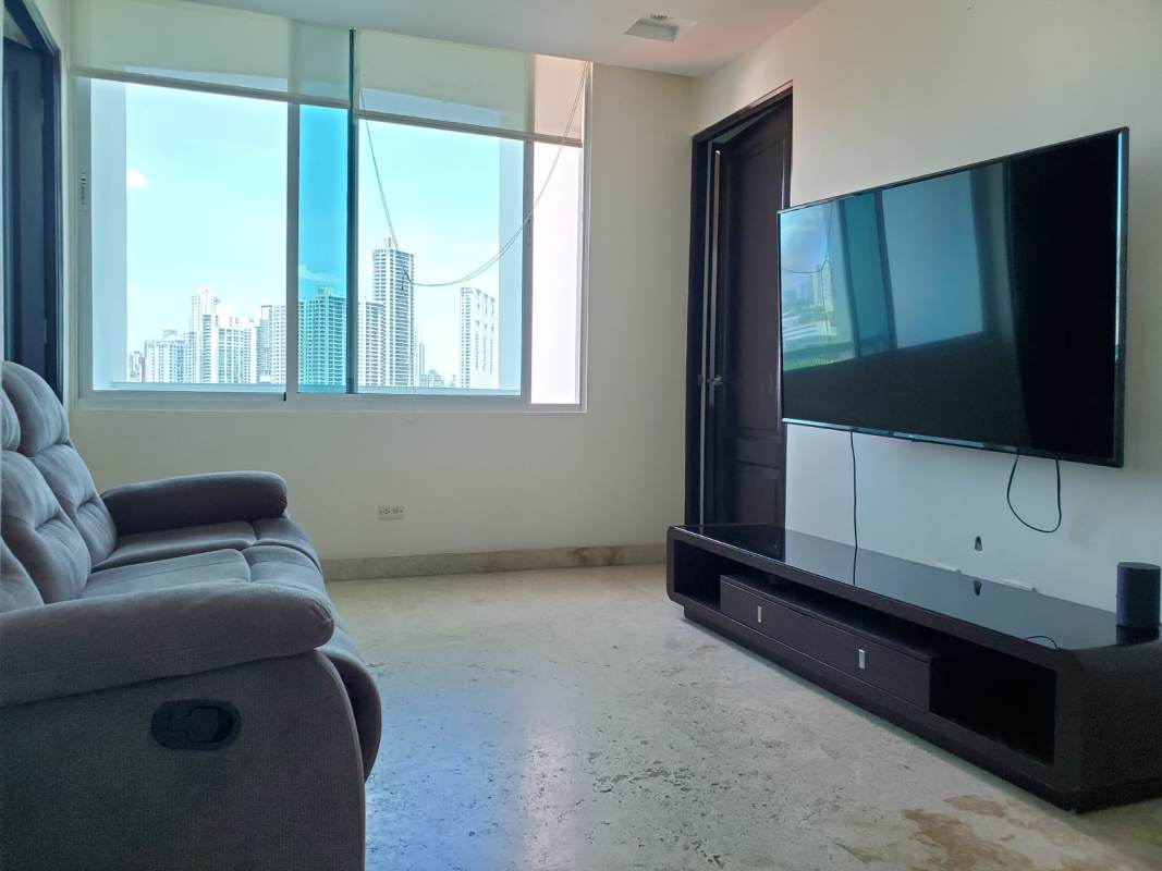 Contemporary kitchen with wood cabinetry granite countertops stainless appliances in PH Ocean Drive