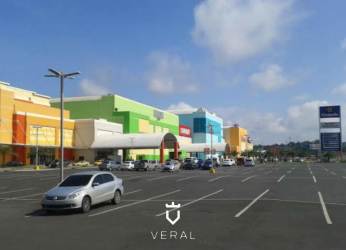 Urban retail shopping mall colorful facade palm trees Westland Mall Panama Oeste