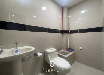 Minimalist modern bathroom with sink and toilet inside retail unit at Westland Mall Arraiján