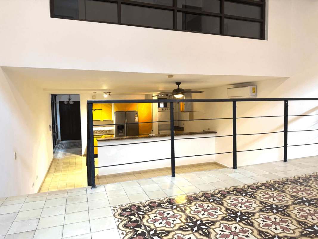 Modern kitchen with yellow cabinets granite countertops stainless appliances loft design Casa Ruigar Casco Viejo Panama