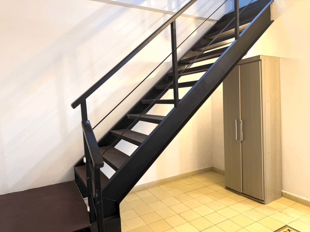 Spacious bedroom hardwood floors AC colonial windows Casa Ruigar Casco Viejo Panama