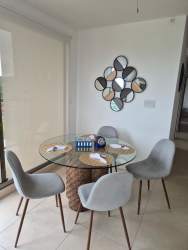 Balcony with seating area overlooking lush greenery in PH Parterre Panama