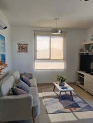 Bathroom with glass enclosed shower, modern fixtures at PH Parterre Panama Pacifico