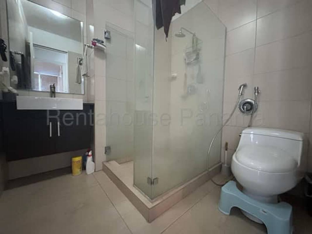 Minimalist bathroom with glass shower and vanity in PH Vista Balboa Panama City