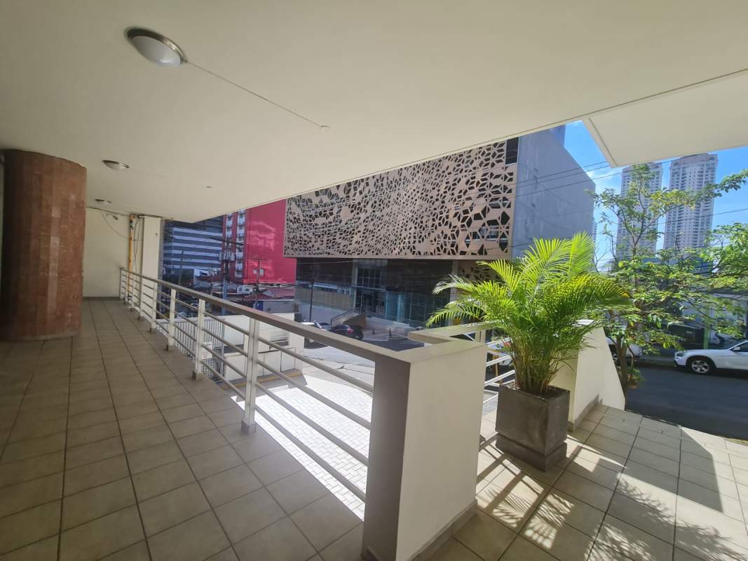 City street view with covered commercial plaza exterior in Panama Obarrio district for rent