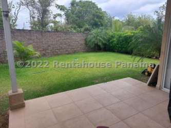 Patio area with tiled flooring overlooking garden at beachfront Coronado gated house