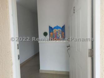 Bright interior entryway white walls decorative niche in Coronado Panama home