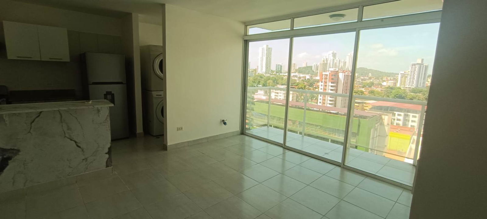 Bright living room with access to balcony city views in PH Metropolitan Park Panama City