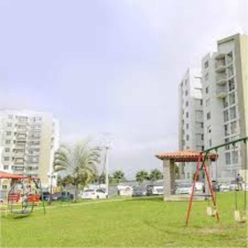 Apartment complex with playground, gazebo, and green landscaped area in Panama City