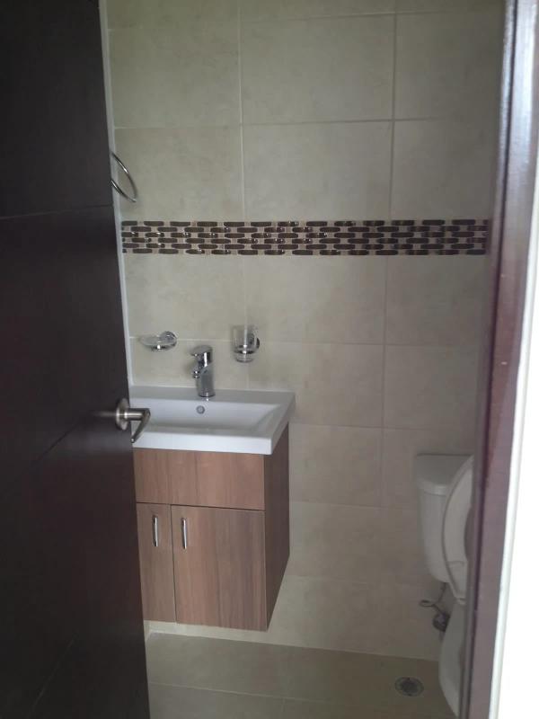 Bright hallway with tiled floors leading to bedrooms in apartment PH Vista del Rocío Villa Zaita