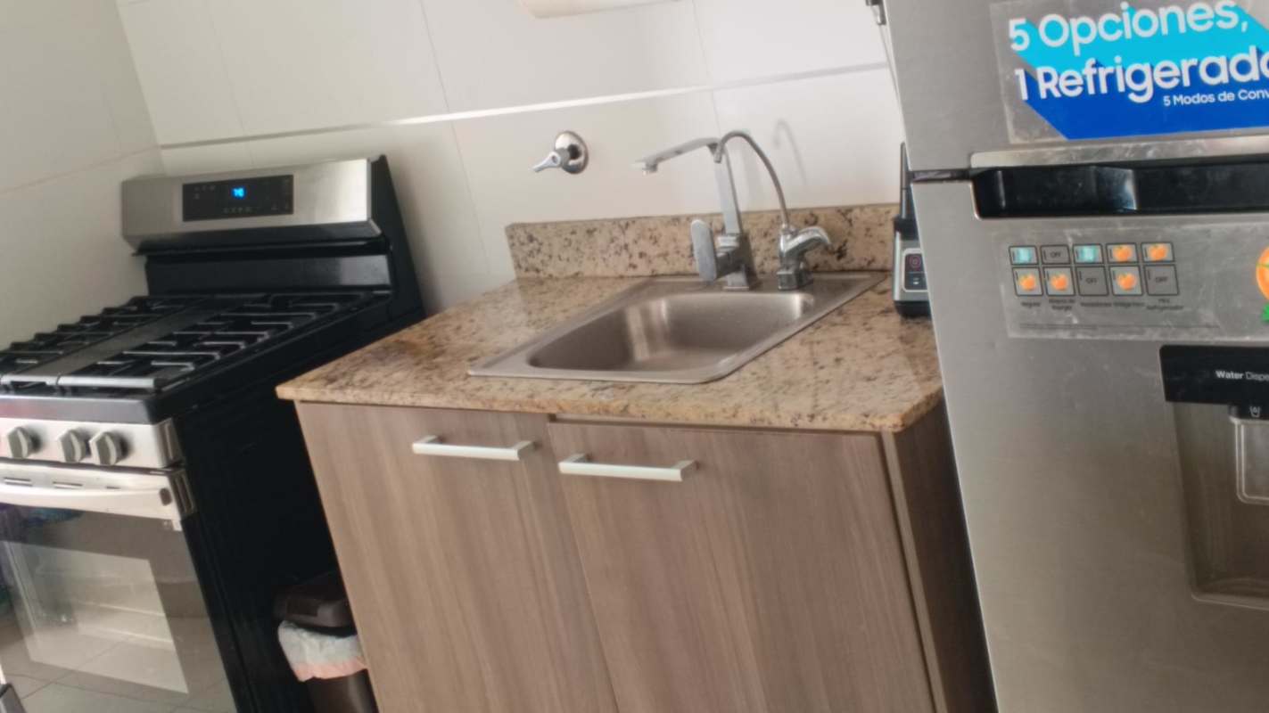 Contemporary kitchen with granite top, stainless appliances at PH Vista del Rocío Panama City