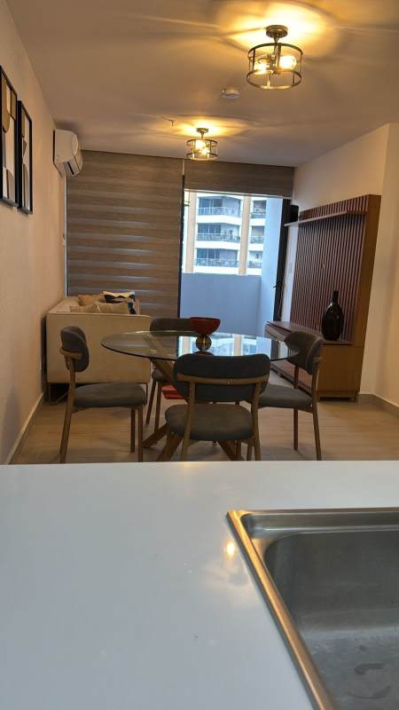 Furnished master bedroom with split AC and window view to Panama skyline in Sky 66 Tower