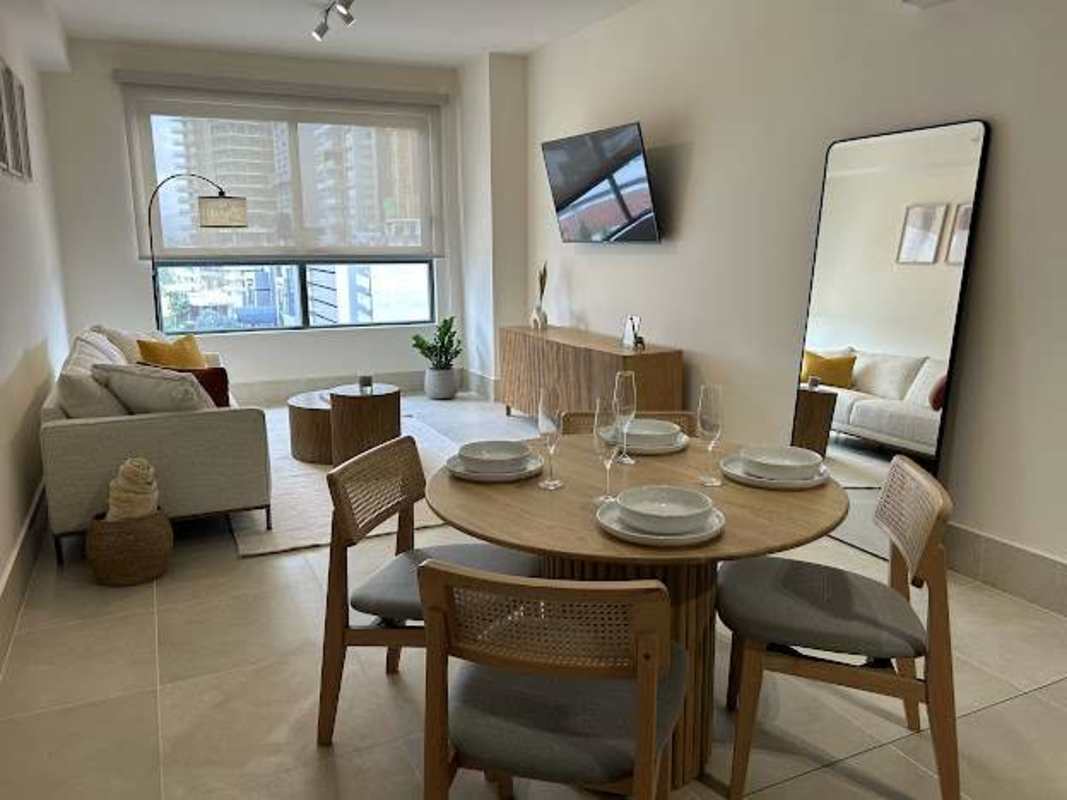 Open-concept kitchen with island and stainless appliances at Santa Maria Golf & Country Club apartment Panama