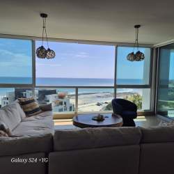 Living room with panoramic Pacific Ocean view in PH Rio Mar luxury condo Coronado Panama