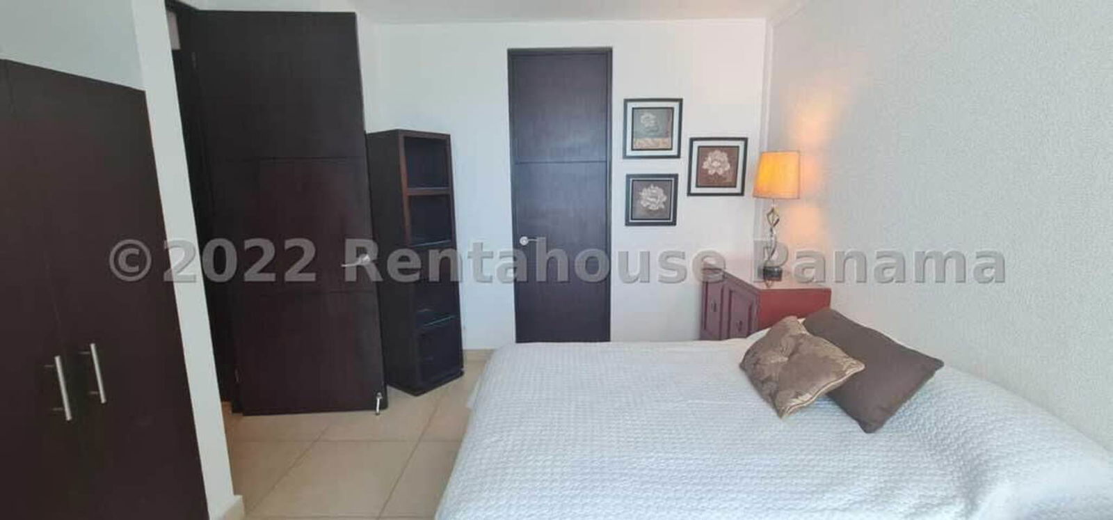 Master bedroom with large window overlooking Pacific Ocean in PH Sky Panama City