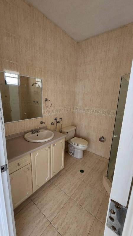 Modern bathroom with glass shower enclosure marble flooring PH Terranova in Panama City