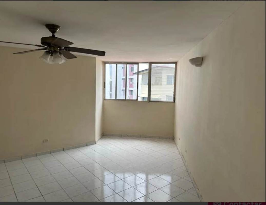 Open living area with beige tile floor and ceiling fan in PH Villa Florencia Panama