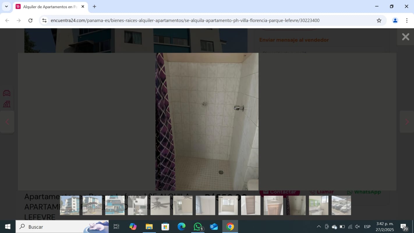 Multi-story blue and white apartment building with balconies and gated entrance Parque Lefevre Panama