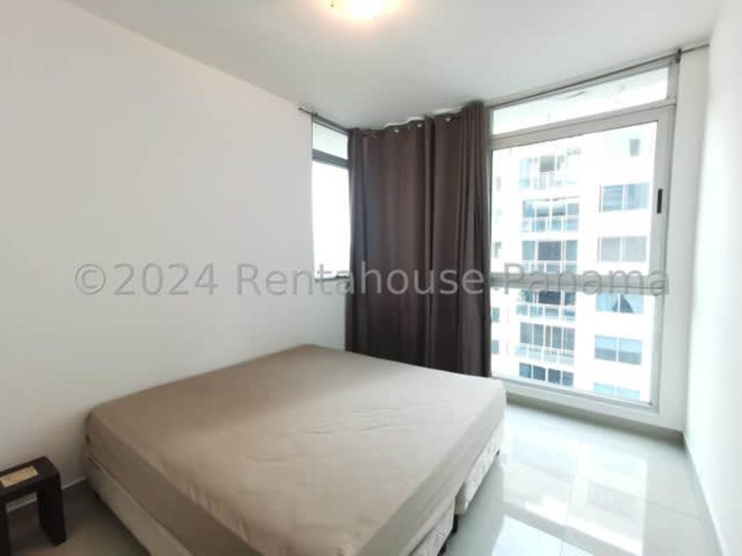 Bedroom with built-in closet, tile floors, AC and panoramic city view in PH Astoria rental Panama City