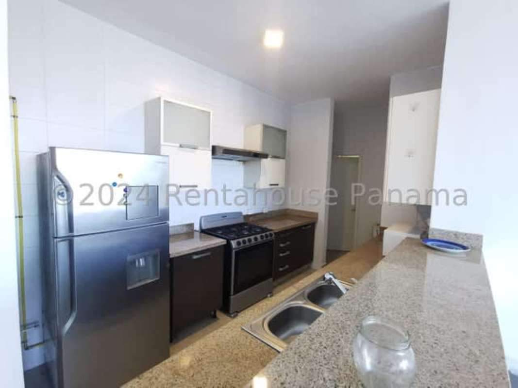 Modern kitchen with granite countertop, appliances and storage PH Astoria El Cangrejo Panama apartment
