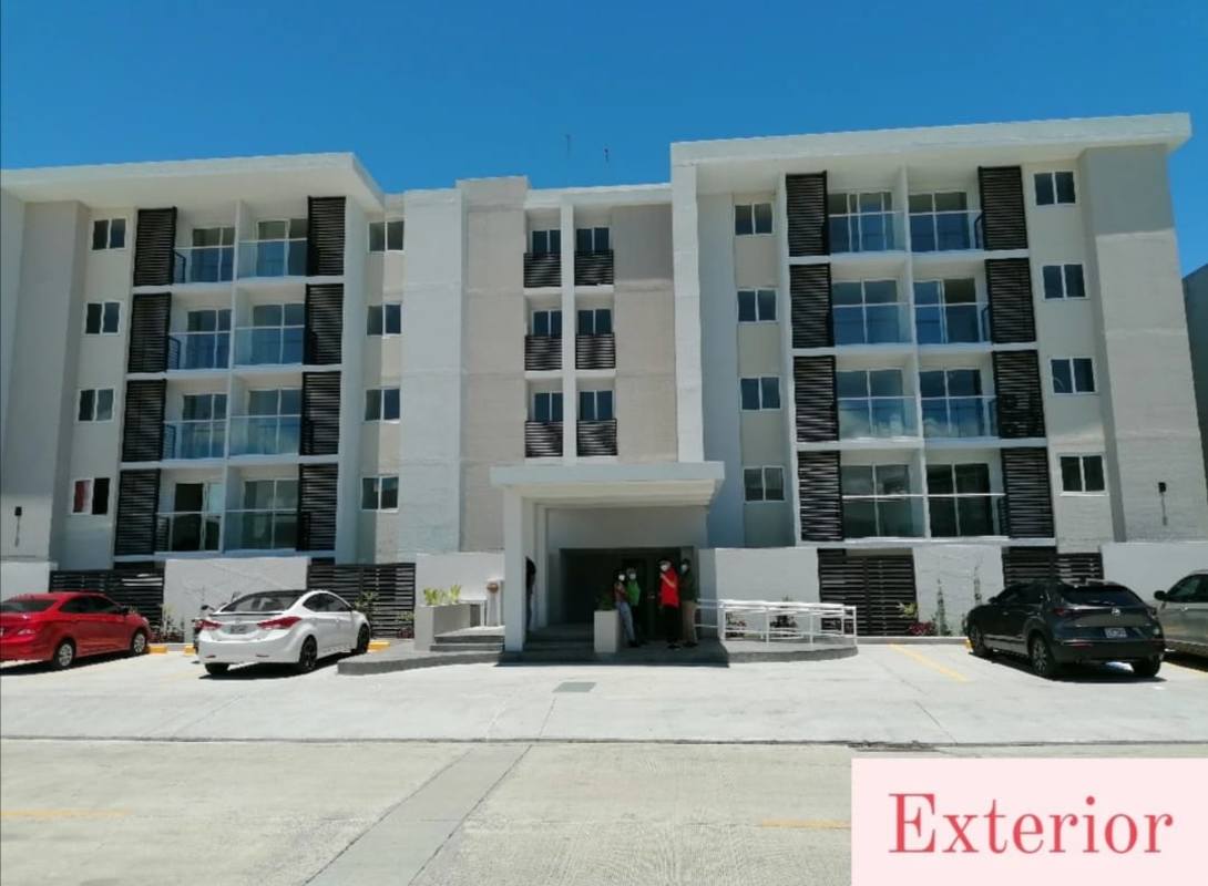 Modern mid-rise apartment building in PH Panamá Viejo Residences with balconies and parking area in Chanis Panama City