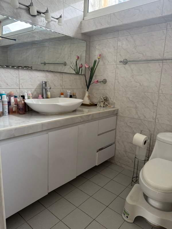 Equipped kitchen with white cabinets and granite counters PH Plaza Paitilla Panama