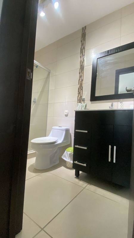 Bathroom with glass-enclosed shower and modern fixtures at PH Kings Park Panama City