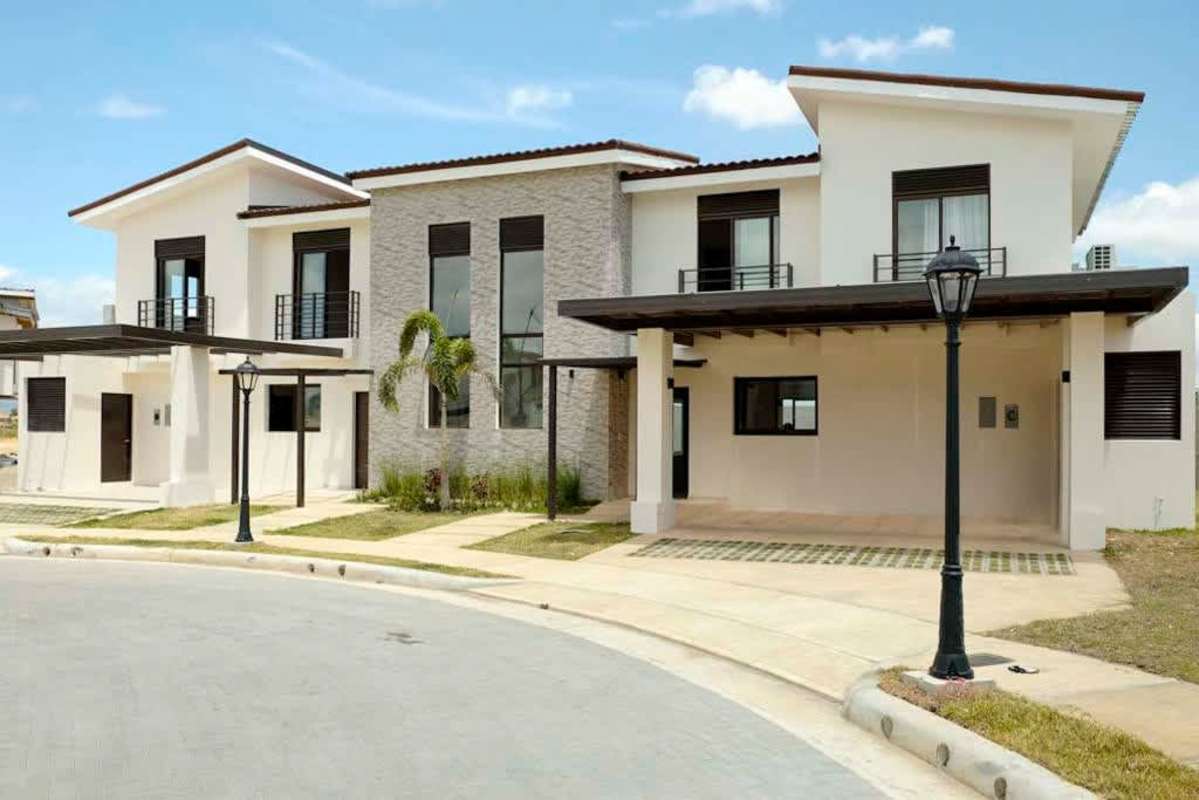 Bright dining room with sliding glass doors and modern decor in Costa Linda Costa Sur Panama