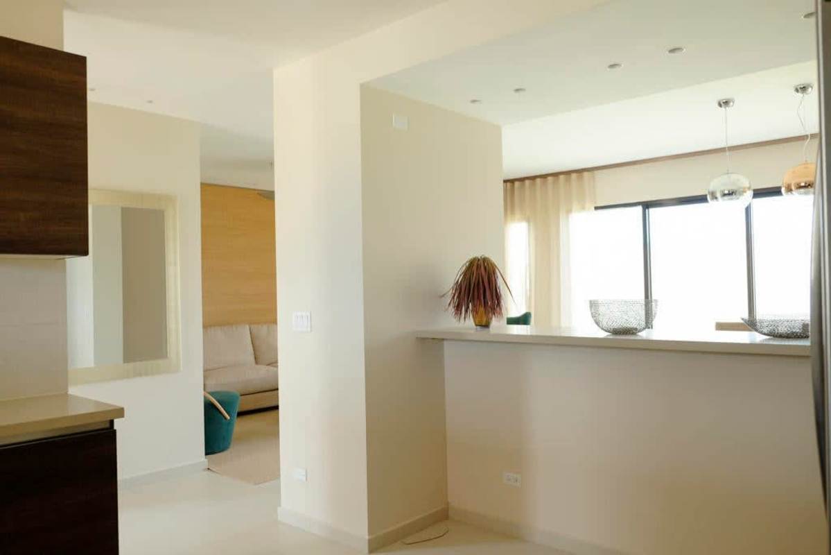 Open concept living and kitchen with breakfast bar for sale Costa Linda Panama