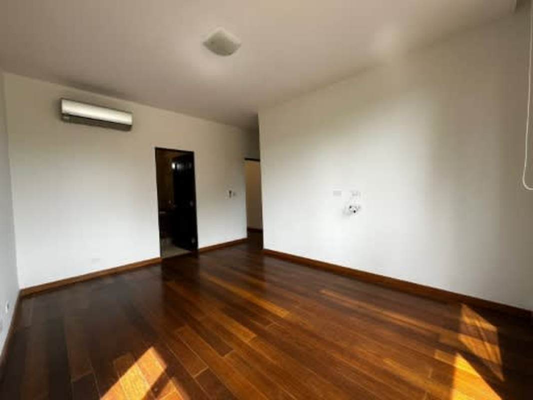 Spacious living dining area with wood floors and garden views Embassy Club Clayton