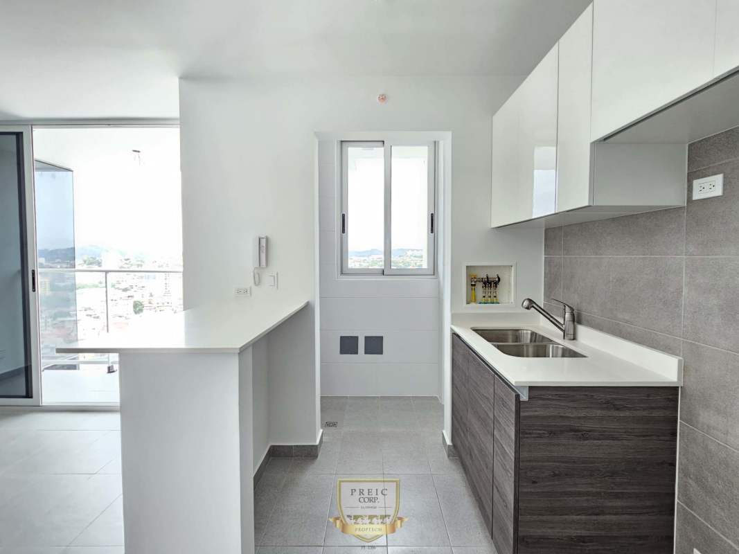 Open kitchen design with counter breakfast bar and access to balcony PH Park Square Panama