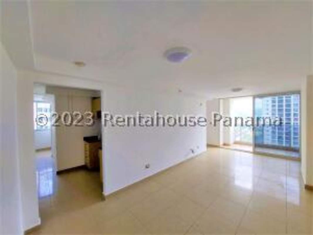 Modern kitchen with granite countertop, wood cabinets, and window PH Rokas Condado del Rey Panama
