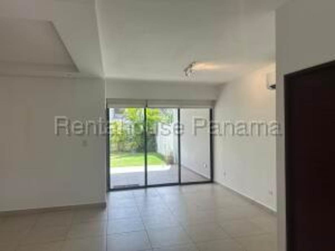 Bright open living dining area with tile flooring, pendant lights and balcony access in Brisas del Golf Panama City