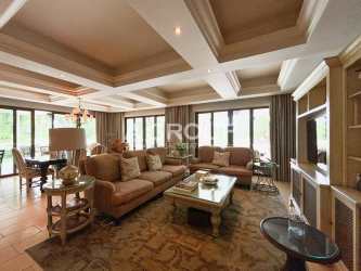 Large dining room with chandelier and garden views in Buenaventura luxury apartment Panama