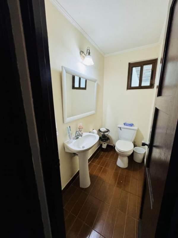 Spacious private backyard with outdoor bar and lounge area in house in San Francisco Panama