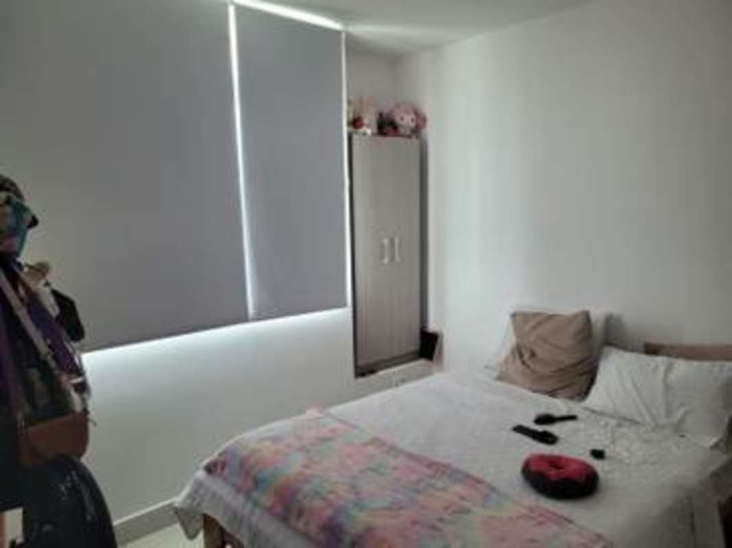 Bedroom with large window, wardrobe, and modern neutral decor in Vivendi 300 Panama