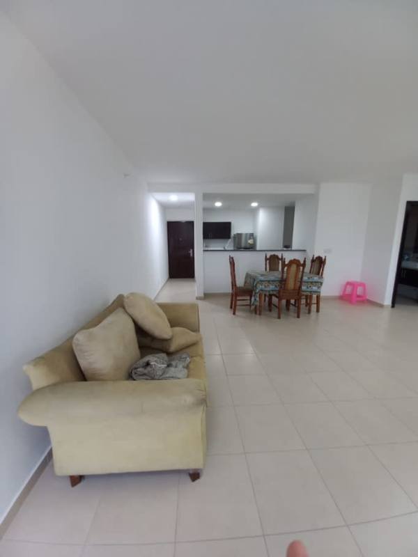 Bright furnished living and dining room with ceramic floors and balcony access at Macedonia Towers El Ingenio Panama