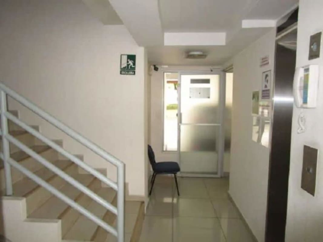 Lobby area with elevator access and staircase at PH Mallorca Park Gardens 2 San Miguelito Panama